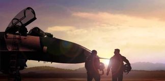 Endless Retaliation Cycle — No Exit In Sight Two pilots walking beside a fighter jet at sunset