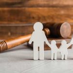 Traveling Preacher Exposed — Horror Spanned Five States Paper cutout family with gavel in background