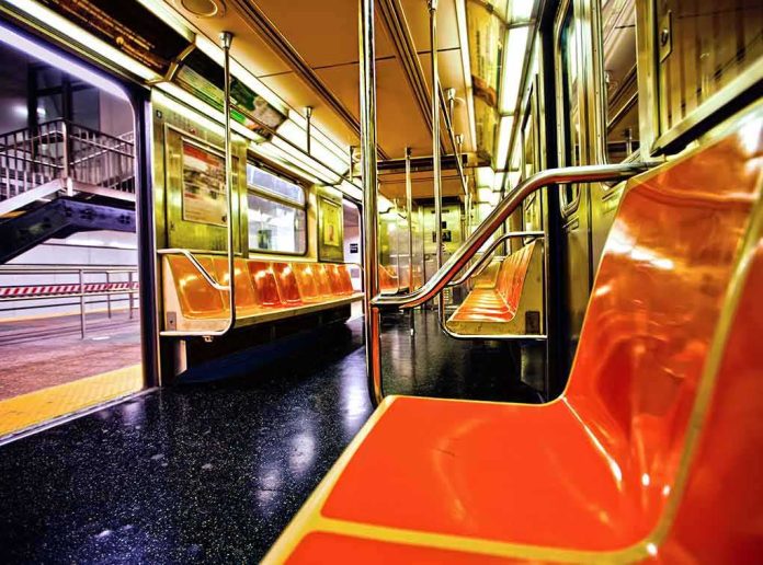 Empty subway car with orange seats and open doors