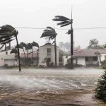 Weaker Storm, Bigger Mess Houses battered by hurricane winds and flooding