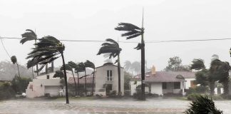 Weaker Storm, Bigger Mess Houses battered by hurricane winds and flooding
