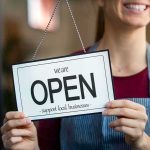 Salon Showdown Caught On Camera Shop worker holding an open sign
