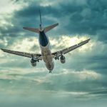 AI Hijacks Atlantic Flight Paths Commercial airplane approaching for landing under dramatic cloudy sky