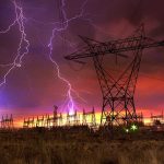 Hot Nights, Costly Lights Hit Japan Lightning strikes illuminate a power station against a colorful sunset sky