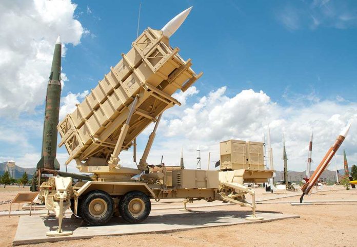 shutterstock_55040773 Patriot missile defense system on display outdoors with various missiles in the background