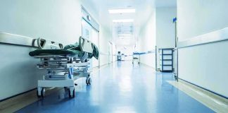 Hospital corridor with empty gurney