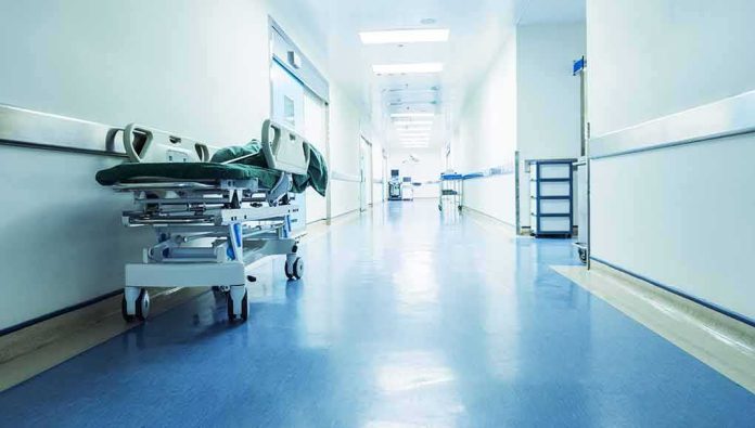 Hospital corridor with empty gurney