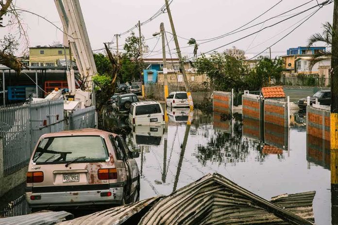 Flooded urban street with abandoned cars and downed power lines