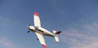 Single-engine airplane banking in a clear sky