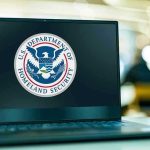 Probable Cause, Deadly Shot — Huge Gap Laptop displaying U.S. Department of Homeland Security logo.