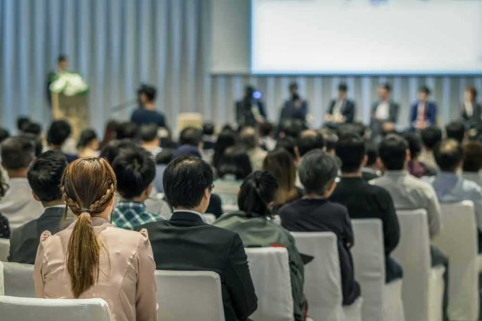 Bill Kenney at a conference panel with an audience