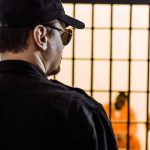 Elder Parole Fury Erupts in California Security guard watching inmates behind jail bars