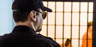 Elder Parole Fury Erupts in California Security guard watching inmates behind jail bars