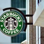 Starbucks coffee shop sign on building exterior