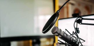 Four-Word Jab Sparks Tribal Meltdown Podcast microphone with pop filter on desk