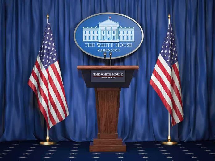 shutterstock_1159933525-2 White House press podium with microphones and two American flags
