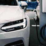 electric car charging at a station