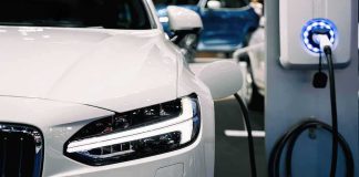 electric car charging at a station