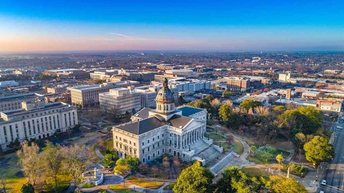 State capitol building with dome in a cityscape at sunrise
