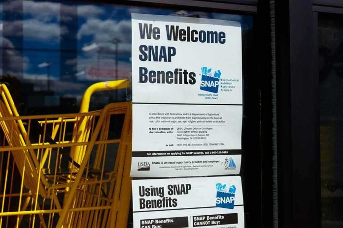 shutterstock_1346649902 Store window with SNAP benefits signs and yellow shopping carts