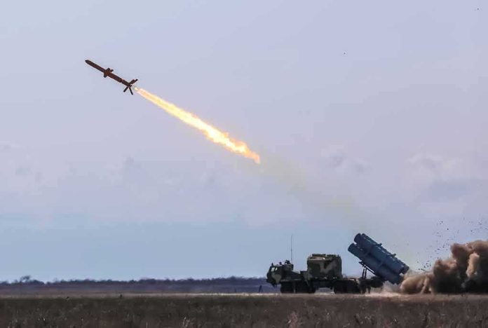 Cruise missile launches from mobile launcher in open field