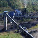 Army Bases: Minerals In, China Out Coal processing plant with conveyor belts in a forested valley