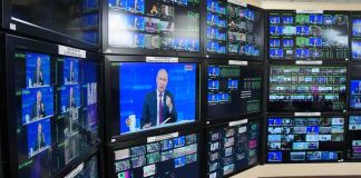 broadcast control room wall of monitors