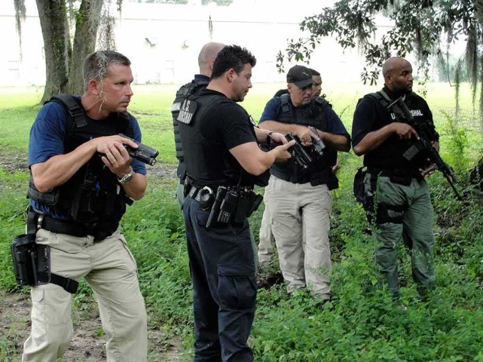 law enforcement officers conducting a search in a wooded area