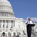 Louie Gohmert speaking at a podium outside the U.S. Capitol