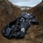 DNA Tags Only—Families Left Waiting Body bags in a mass grave trench