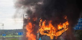 Construction Zone Twist Ends In Tragedy burning bus on highway with heavy black smoke