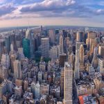 Aerial view of a dense city skyline at sunset
