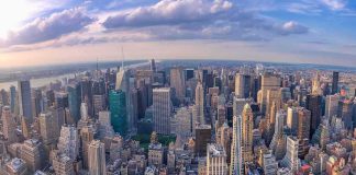 Aerial view of a dense city skyline at sunset