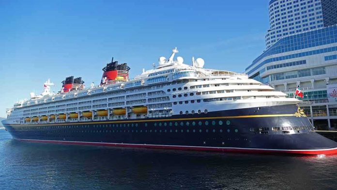 shutterstock_1985807390 Cruise ship docked at a modern harbor terminal