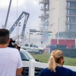 Looting, Blackouts, Missing — Numbers Don’t Add Up Rescue crews and cranes clear debris at a damaged high-rise building