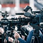 Chilling Find Near Planet Fitness Broadcast cameras on tripods at a press event