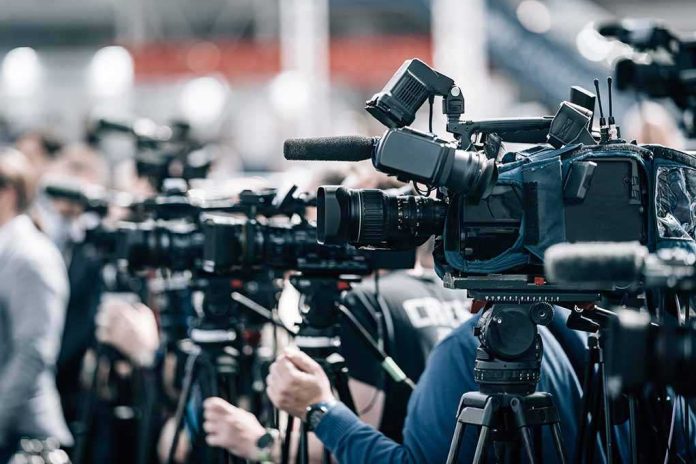 shutterstock_2197858977-3 Broadcast cameras on tripods at a press event