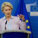 Europe Blinks. Trump Squeezes Hard Speaker at podium during EU press conference