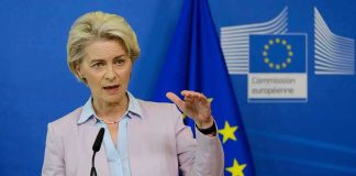 Speaker at podium during EU press conference