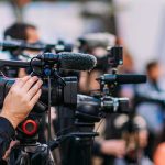 Shocking Socialist Sweep Jolts New York Video cameras on tripods at a media event