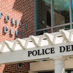 One Call, Kids Gone — No Evidence Police department entrance with pergola and brick wall