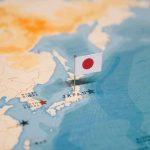 Tsunami Frenzy Meets Cold Hard Facts Japanese flag pin marking Japan on a world map