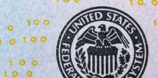 The Fed Is Leaving The Door Open To A Hike Federal Reserve System seal on U.S. currency