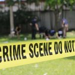Five Relatives Killed Across Three Scenes crime scene tape cordoning off a grassy area