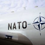 Aircraft fuselage with NATO emblem and lettering