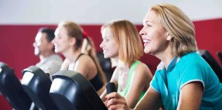 Backlash Erupts: Sport Turned Into Props group of people cycling on exercise bikes at a gym