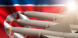 Missiles in front of North Korea flag