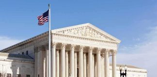 United States Supreme Court building with flag