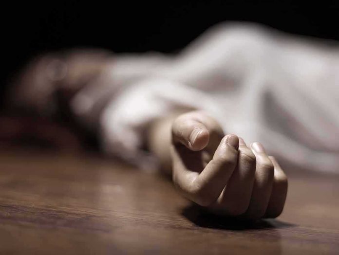 hand of a person lying on the floor