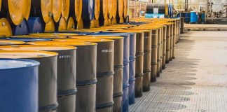 Evacuations and Chaos – Huge Payout But No Guilt? Rows of industrial metal barrels with yellow lids